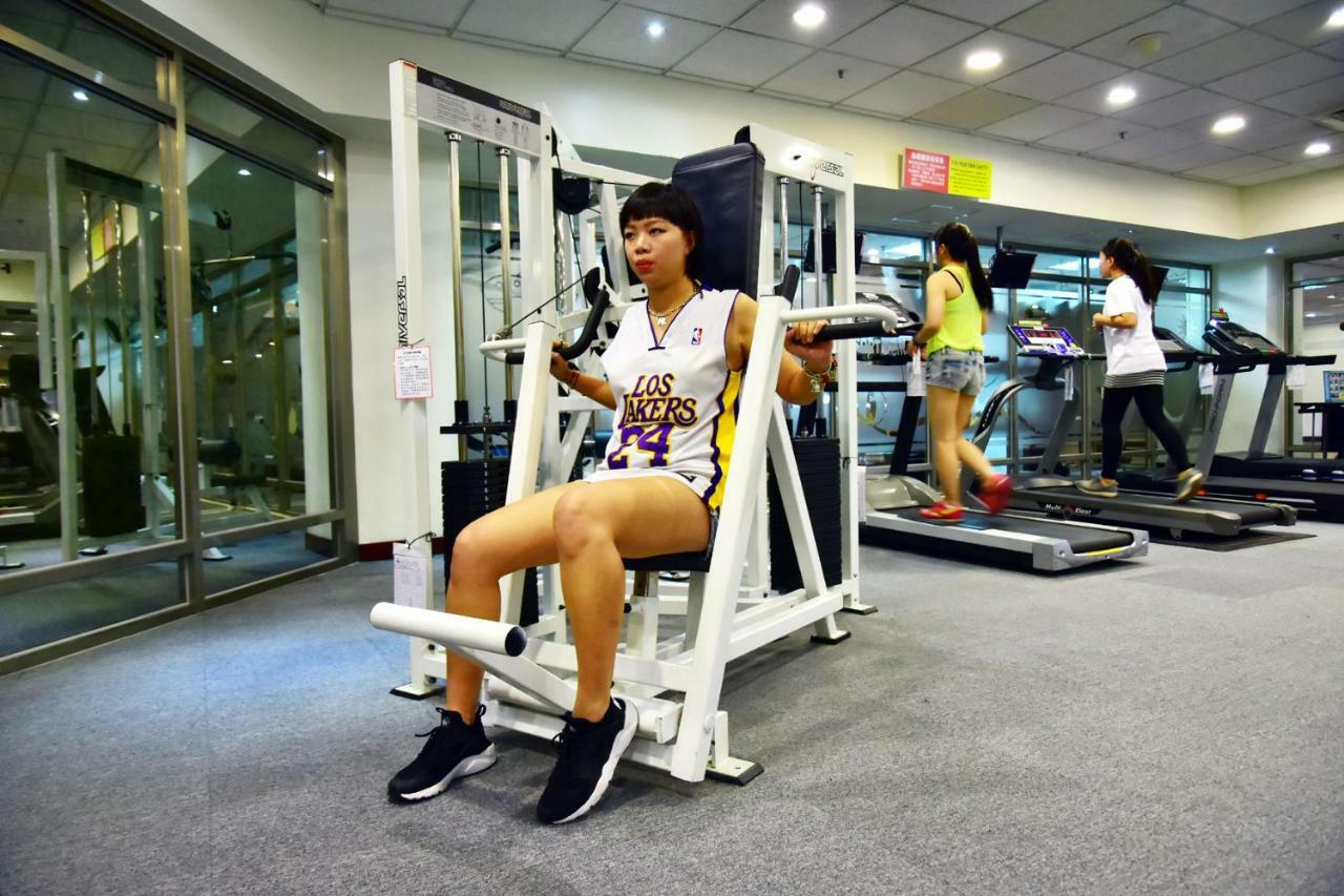 Howard Beach Resort Kenting Exterior photo A woman performing a leg press